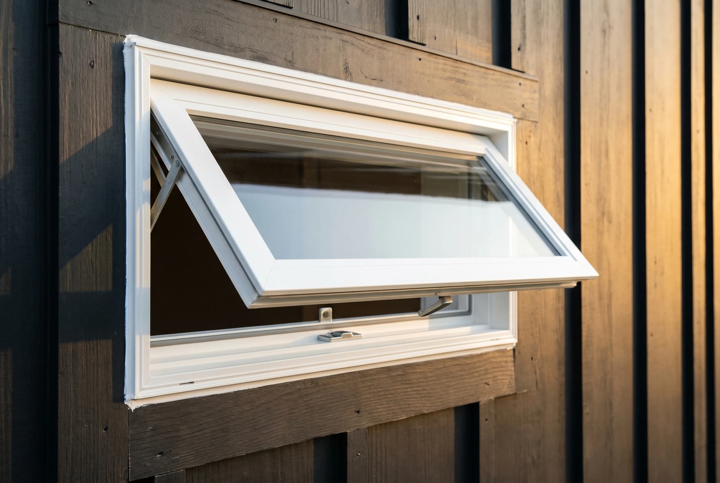 Brand-new Harvey Slimline fiberglass casement window with narrow frame profile, cranked partially open