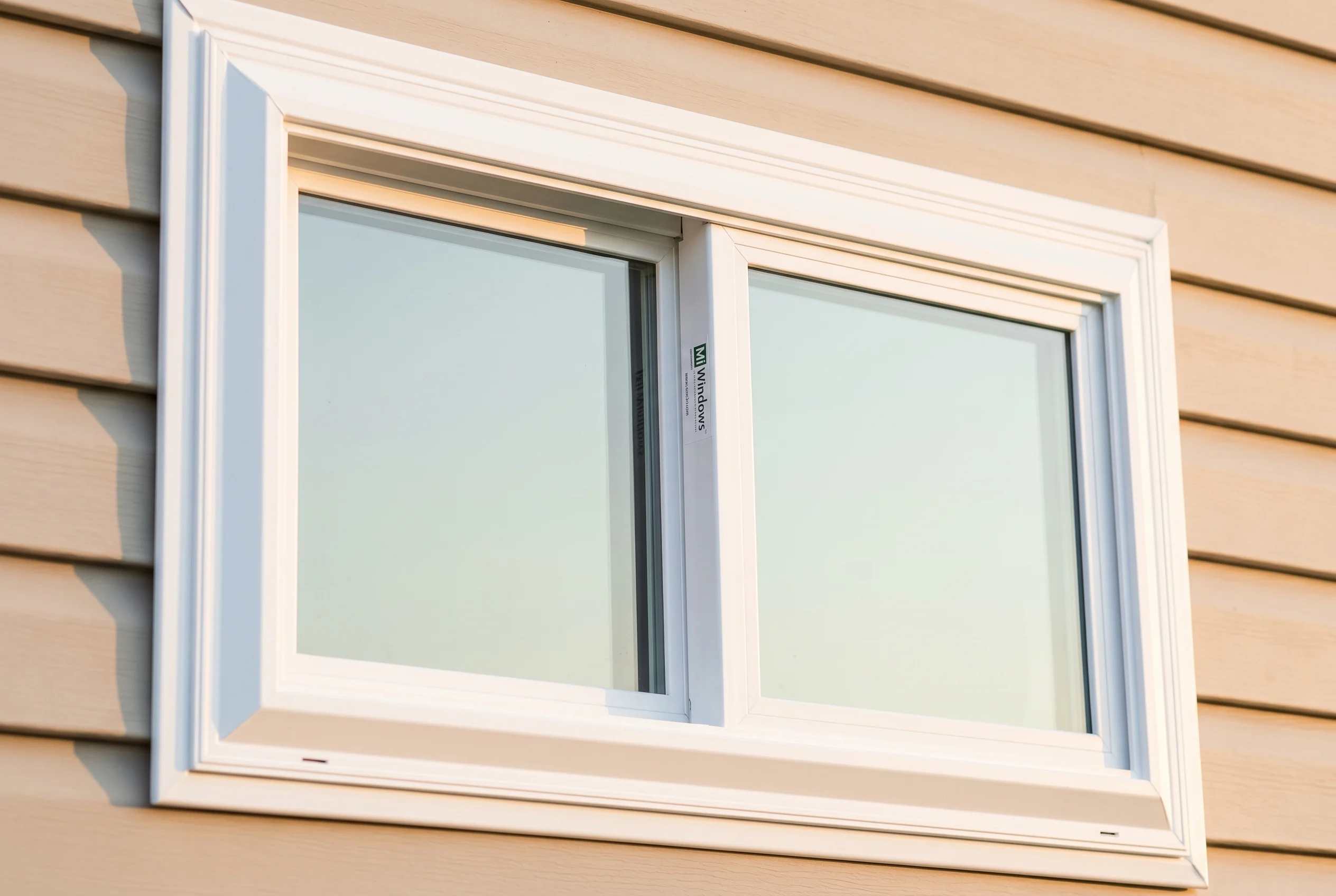 Brand-new MI vinyl horizontal slider window — two sashes side by side with vertical meeting rail, clean white frame