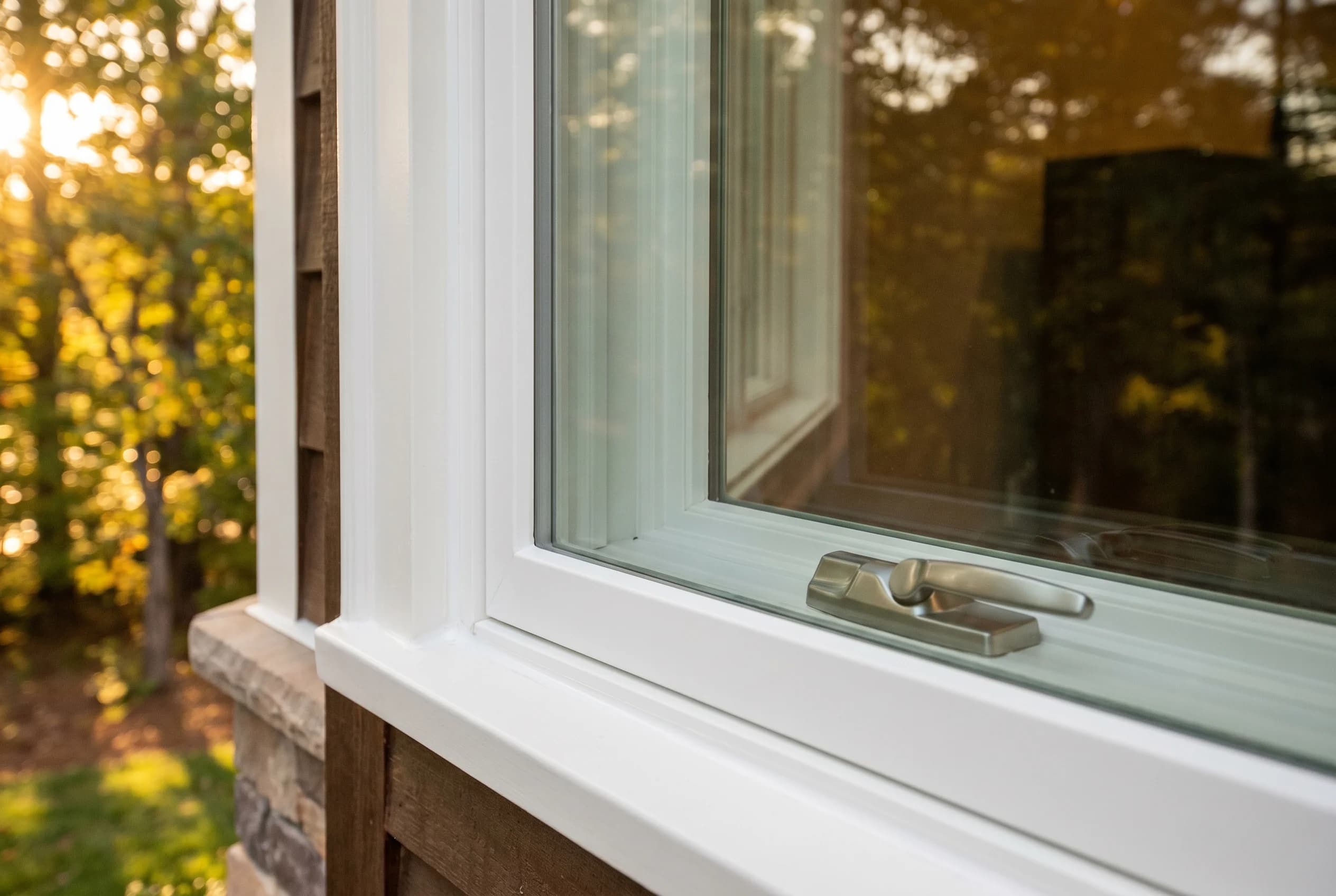 Brand-new ProVia Aspect fiberglass replacement window with notably narrow frame profile, premium painted white finish, casement crank visible